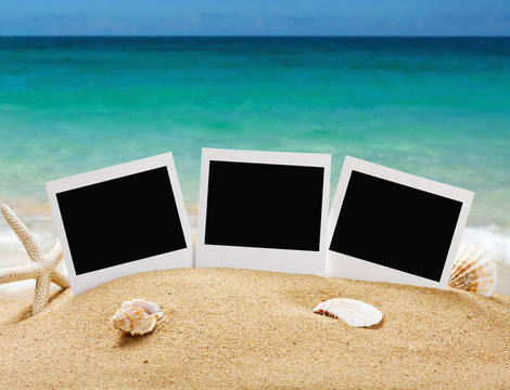 photo frames on the sea sand