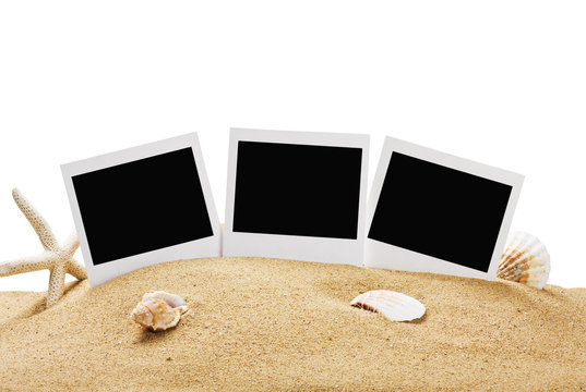 photo frame on the sea sand isolated