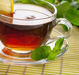 Cup of tea with lemon and mint