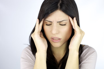 Closeup of woman with strong headache