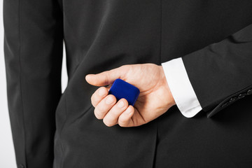 man with gift box in suit