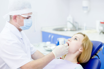 Fototapeta premium young girl visit to the dentist