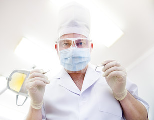 Portrait of  male dentist wearing surgical mask 