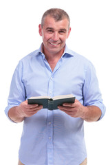 casual middle aged man with his book