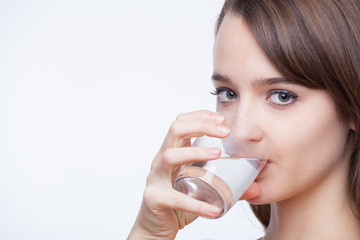 Young woman drinking water.