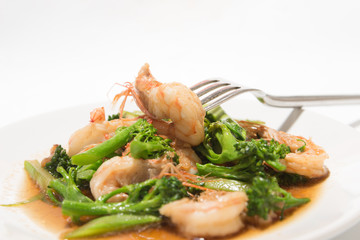 Prawns with broccoli fried sauce on white dish