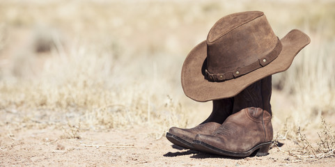 brown cowboy hat and boots outdoor