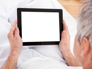 Mature Man Using Digital Tablet