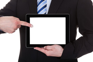 Mature Businessman Showing Digital Tablet