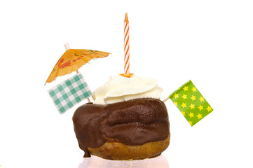 Pastry treat with chocolate topping and whipped cream filling, d