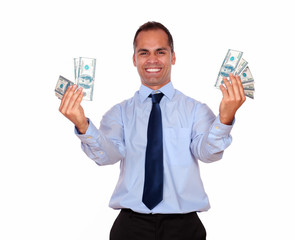 Smiling latin adult man holding cash dollars