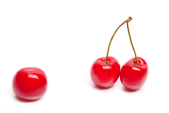 Two cherries against single cherry