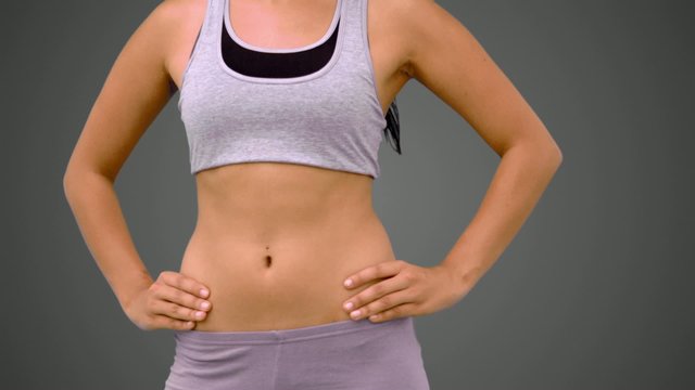Fit brunette turning in sportsbra