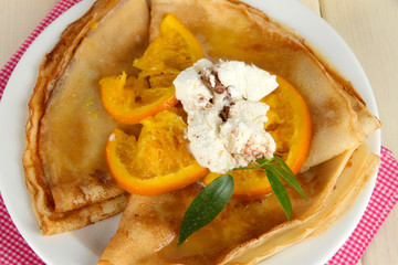 Pancakes with orange  close-up