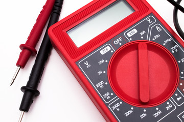 Red digital multimeter isolated on white background