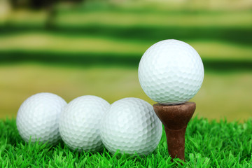 Golf balls on grass outdoor close up