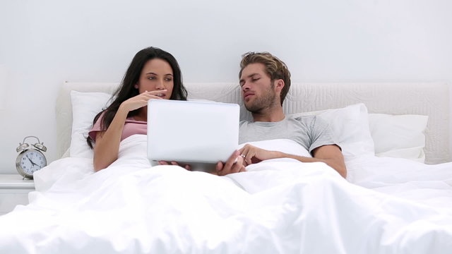 Couple using the laptop together