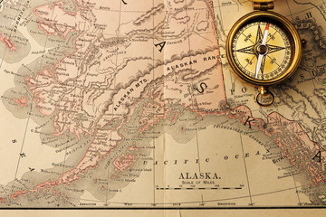 Fototapeta na wymiar Antique compass over old XIX century map
