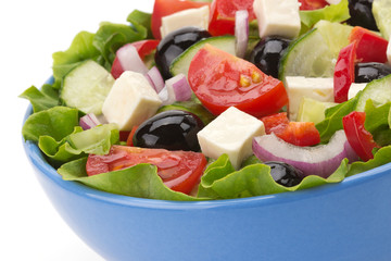 salad in bowl on white