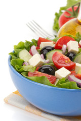salad in bowl on white