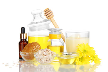 Fragrant honey spa with oils and honey isolated on white