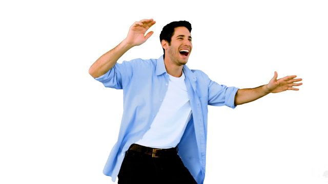 Man dancing and having fun on white background
