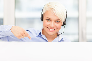 Support assistant indicating with finger on a banner