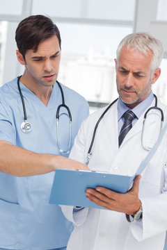 Two doctors talking about a file