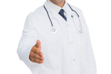 Doctor reaching out for a handshake