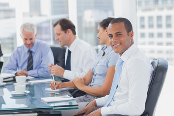 Handsome businessman posing in the meeting room