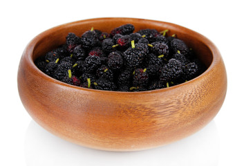 Ripe mulberries in bowl isolated on white