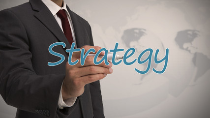 Businessman writing strategy