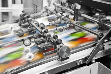 Close up of an offset printing machine during production - obrazy, fototapety, plakaty
