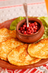 potato pancakes with cranberry sauce