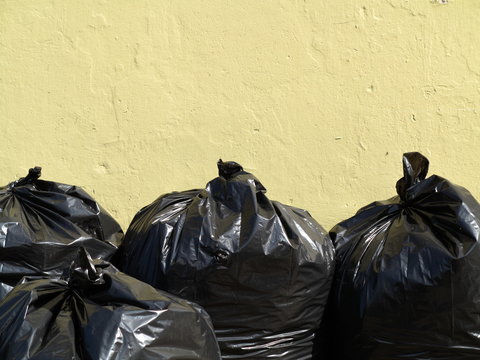Pile of full black garbage bags