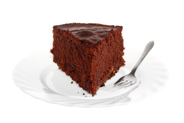 Piece of chocolate cake on white plate