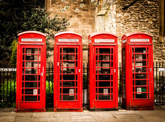 Row of British red telephone boxes