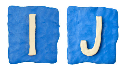 Plasticine letters on a blue background, isolated 