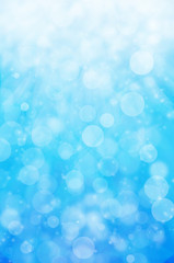 abstract light bokeh on blue background.
