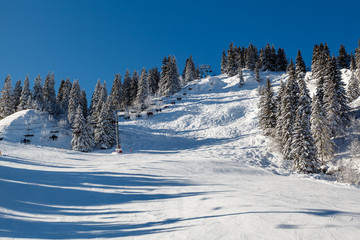Sunny Ski Slope and Ski Lift near Megeve in French Alps, France