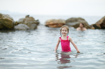 Little girl playing in water