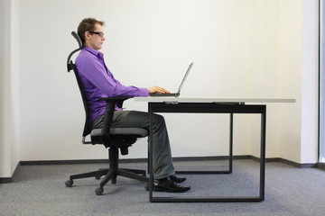 correct sitting position at laptop - obrazy, fototapety, plakaty