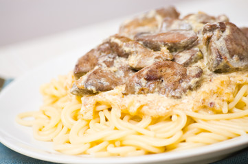 chicken livers in a creamy sauce with spaghetti