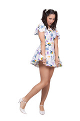 A girl with pigtails in colorful retro dress