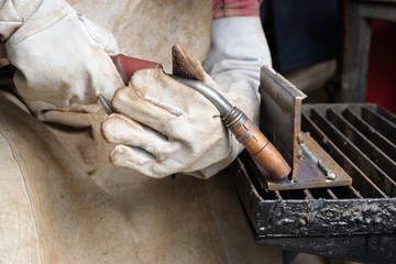 welding torch in hand