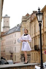 Fototapeta premium Cute girl posing on a city street