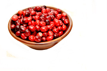 Cranberries in a Wooden Bowl Over White