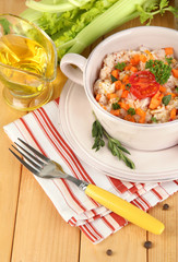 Delicious rice with vegetables and herbs in pot