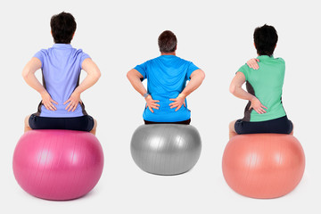 Women and man with exercise ball