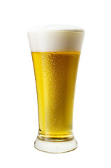 Glass of cool light beer with froth isolated on white background